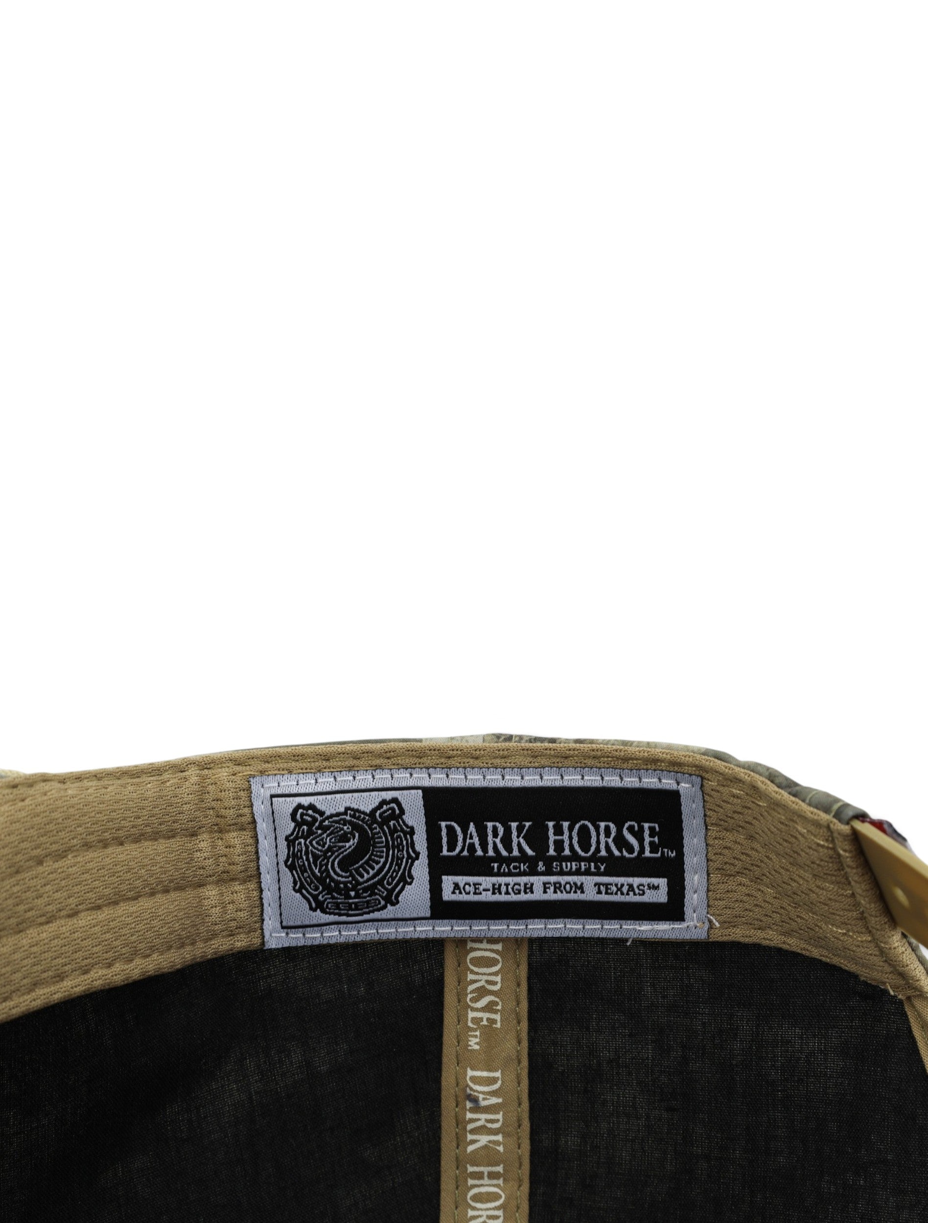 Inside the camo Texas Tech cap showing the Dark Horse Tack and Supply label on the tan sweatband