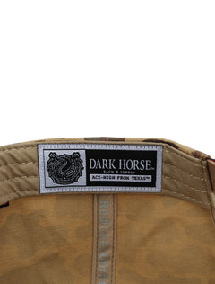 Inside the camo Texas Tech cap showing the Dark Horse Tack and Supply label on the sweatband