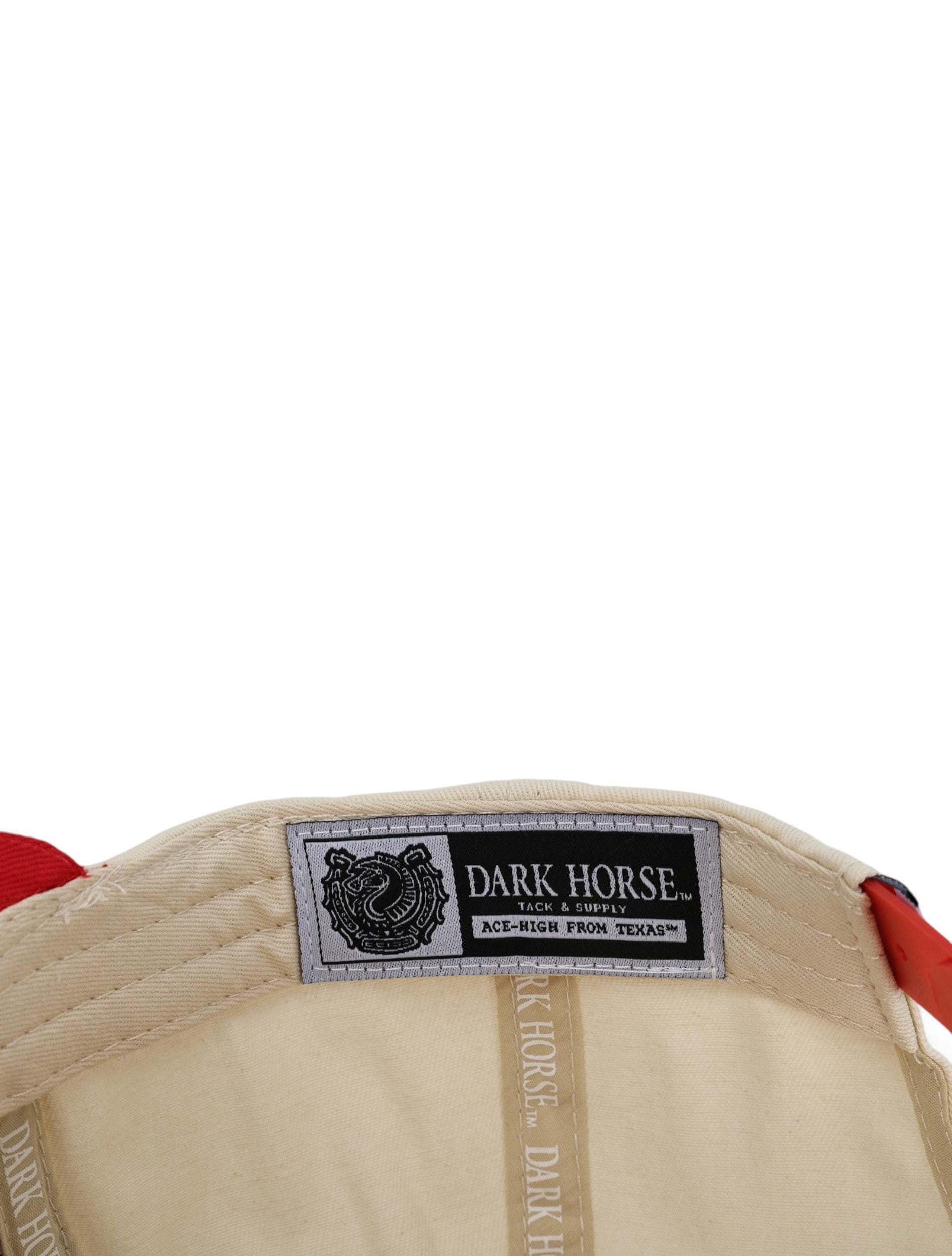 Inside the tan Texas Tech cap showing the Dark Horse Tack and Supply label on the sweatband