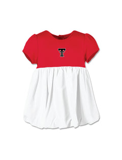 Infant dress with a red puff sleeve bodice, a Double T centered on the chest, and a full white bubble skirt