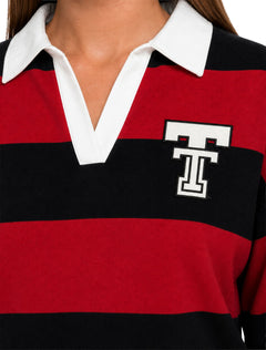 Close up of the white Double T patch applied on the left chest of the Lusso Texas Tech Silvia polo, with the white pointed collar and open V placket