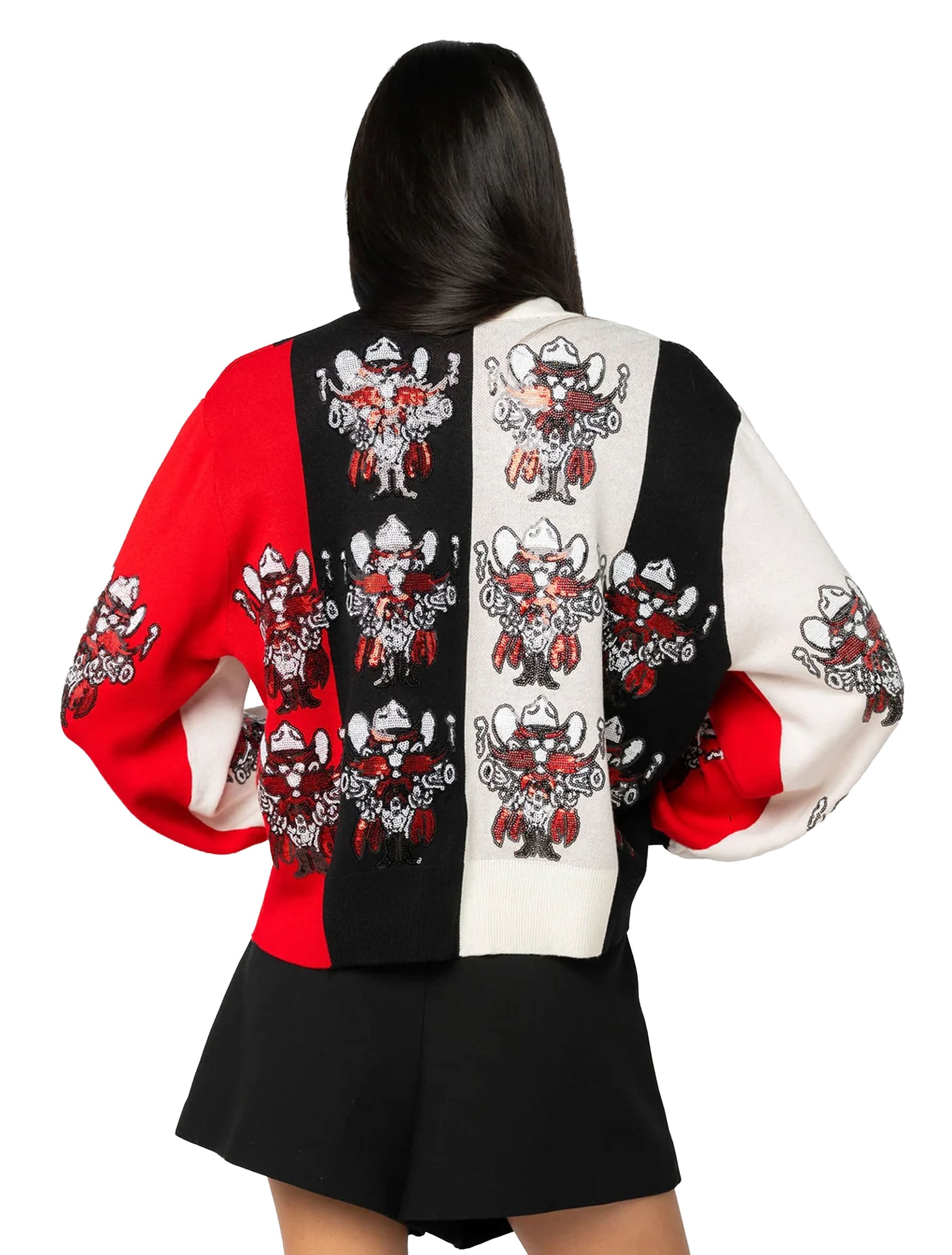 Back view of the cardigan showing the same sequined Raider Red repeating across the red, black, and cream panels
