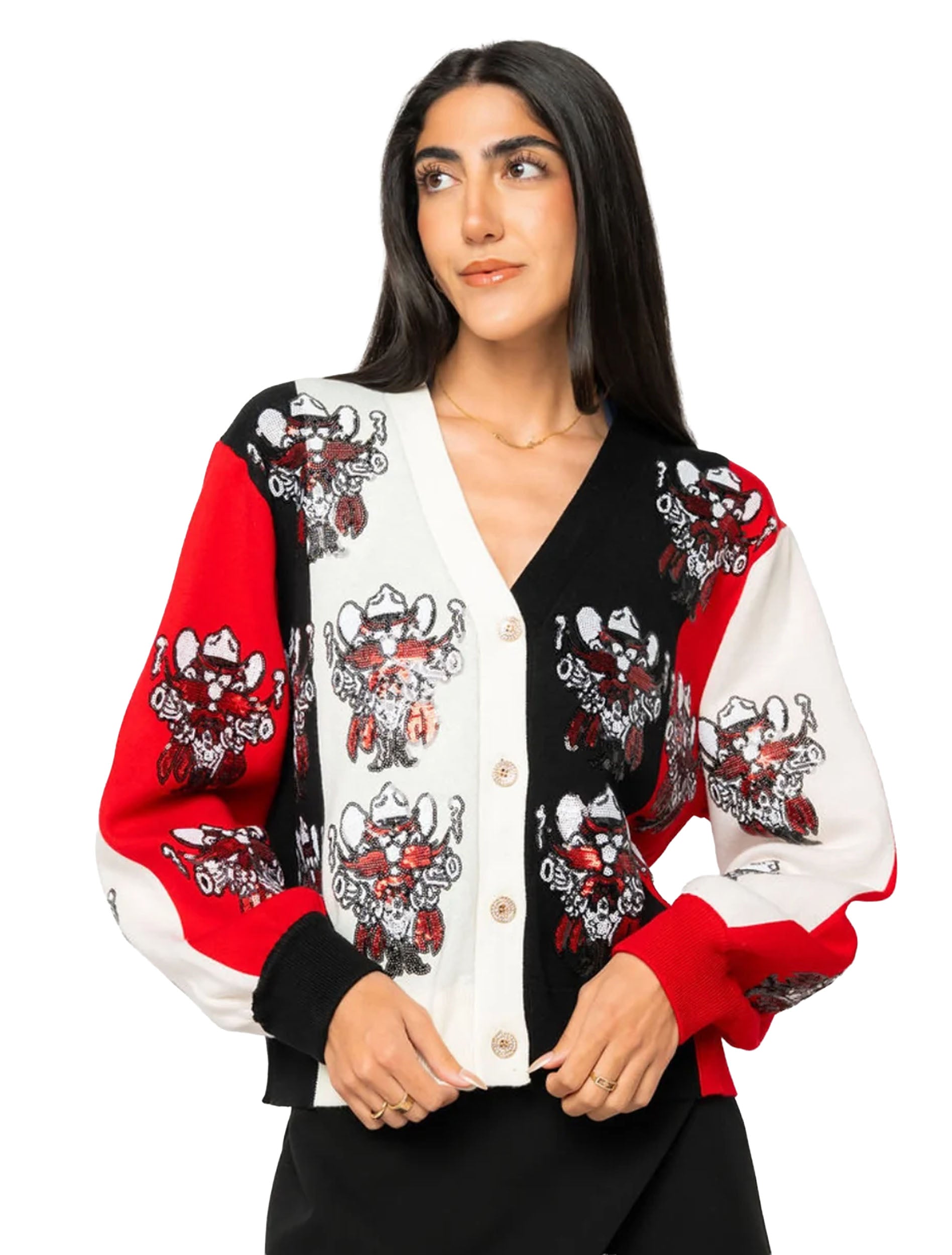 Close front view of the red, black, and cream colorblock cardigan with a sequined Raider Red repeating across the panels and gold toned buttons