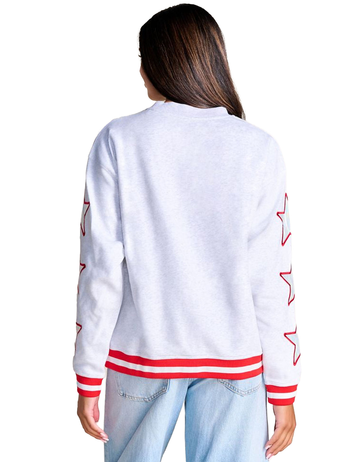 Back of a heather grey crewneck sweatshirt with iridescent stars down both sleeves and a striped ribbed hem