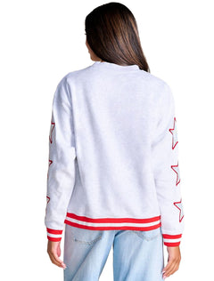 Back of a heather grey crewneck sweatshirt with iridescent stars down both sleeves and a striped ribbed hem
