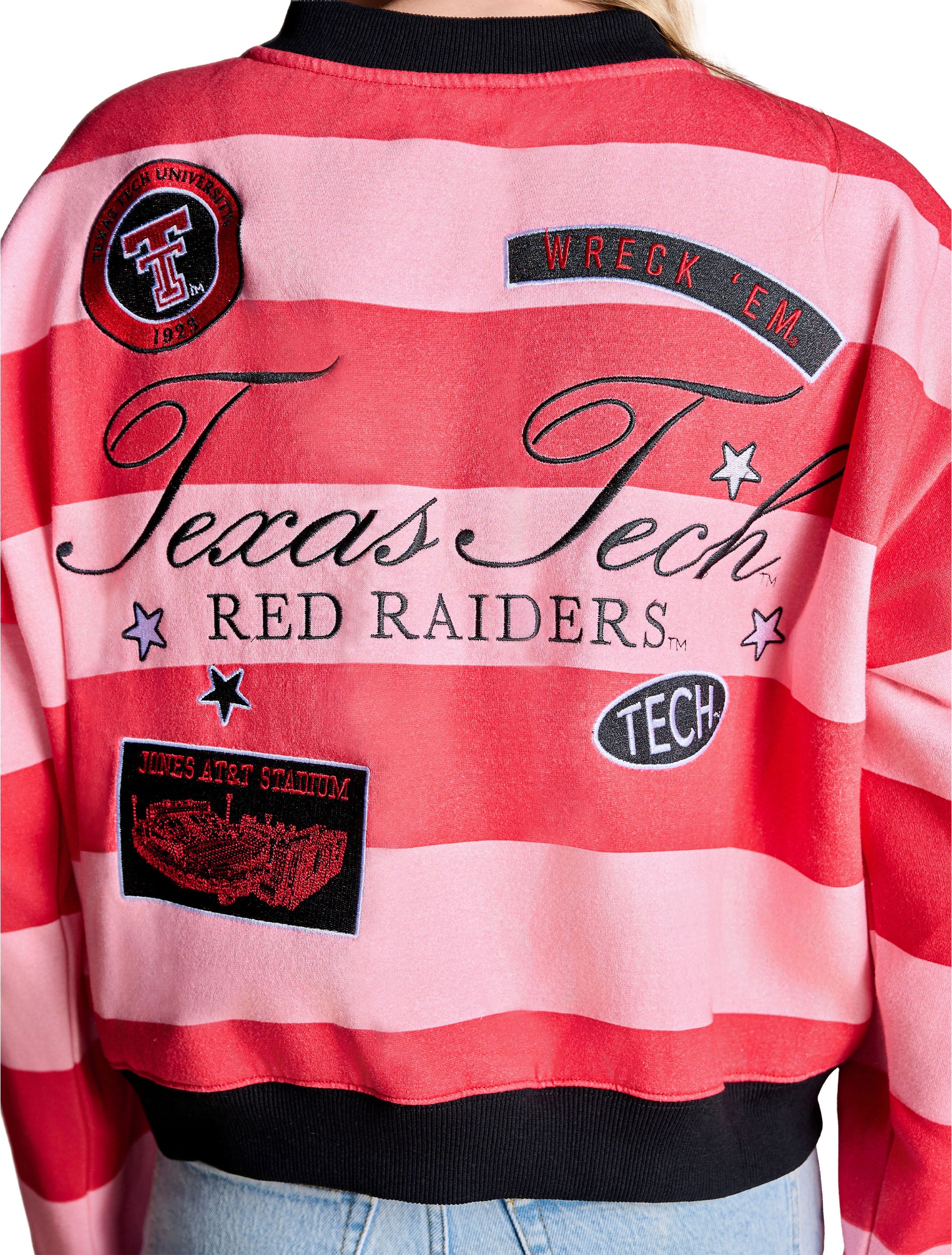 Close up of the back patches, the Texas Tech University 1923 seal, a WRECK ’EM banner, a TECH oval and a Jones AT&T Stadium patch