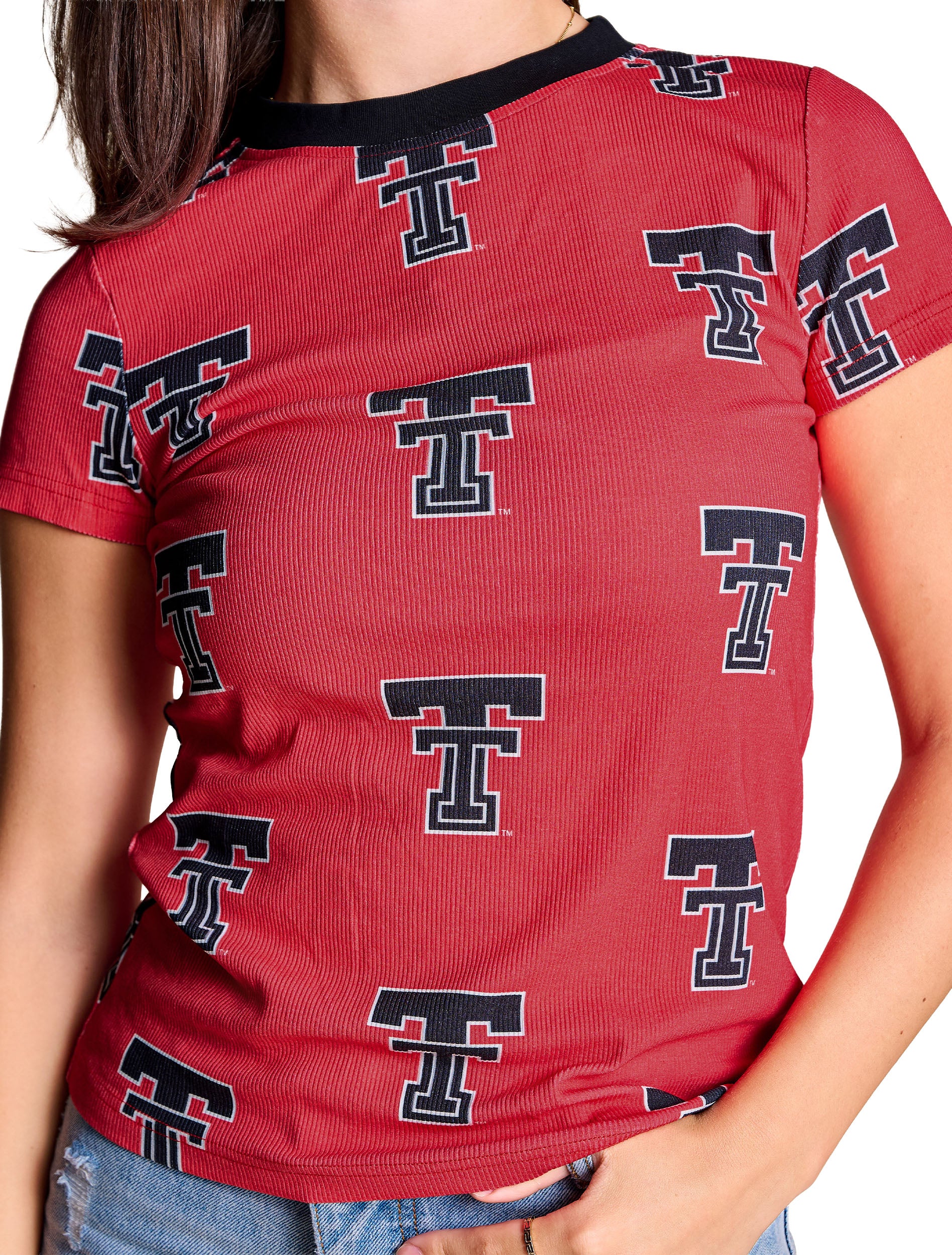 Close up of the rib knit and the black Double T print with white outline on the red Texas Tech baby tee