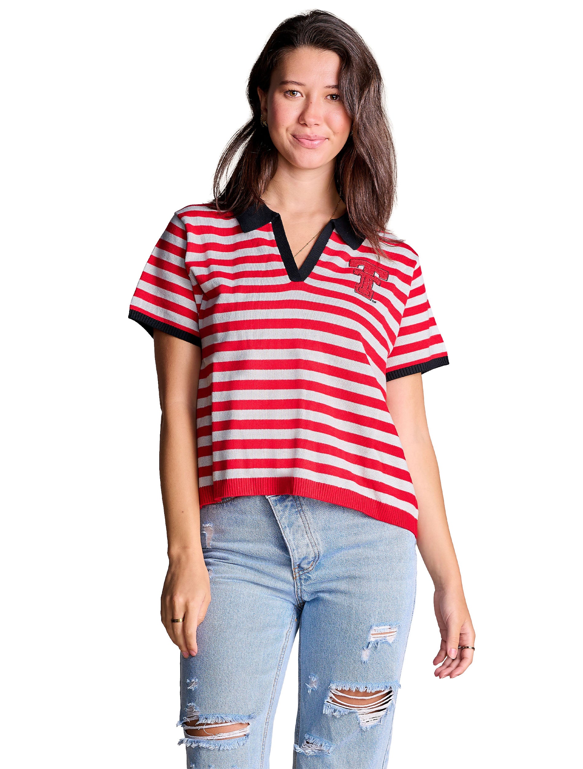 Model wearing the red and white striped Texas Tech collared sweater with a black johnny collar, styled with light wash denim