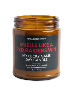 Terra Mater Studio Texas Tech Smells Like A Red Raiders Win soy candle in an amber glass jar with a black label