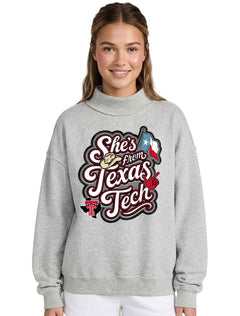 Texas Tech Red Raiders heather grey mock neck sweatshirt with a "She's from Texas Tech" rope-script graphic, cowboy hat, Texas flag, and Guns Up hand