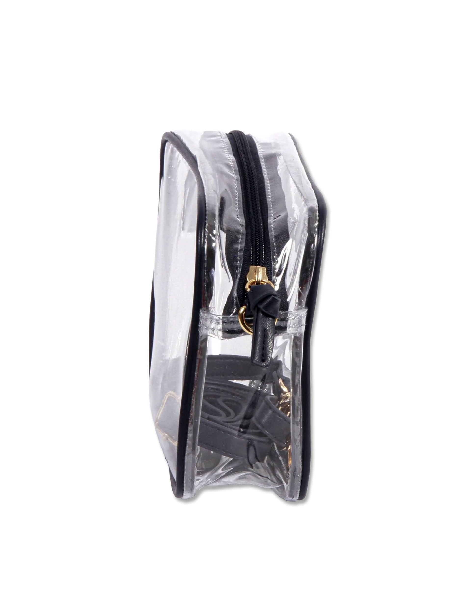 Side view of the clear crossbody purse showing its narrow depth and black zip top with a leather pull tab