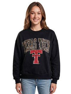 Model wearing the black Texas Tech crewneck sweatshirt with a rhinestone tan leopard print arch over a red Vault Double T