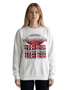 Model wearing the white Texas Tech crewneck sweatshirt with a football graphic and TEXAS TECH repeated over a red Double T