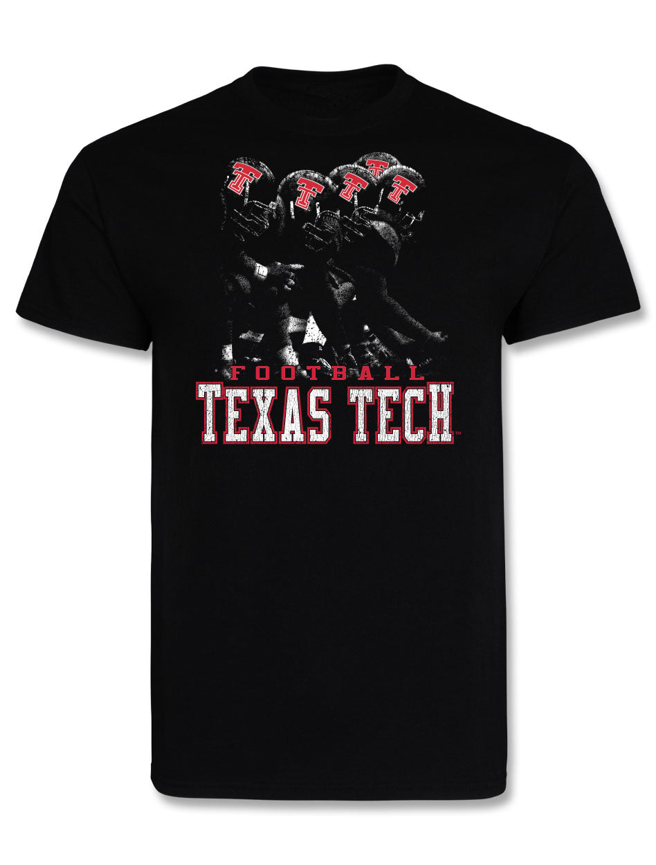 Black Texas Tech tee with a distressed photo of four Double T helmets on the line, FOOTBALL above TEXAS TECH in worn block lettering