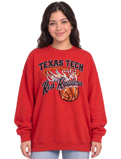 Woman wearing the red Texas Tech rhinestone sweatshirt with the basketball hoop and net design