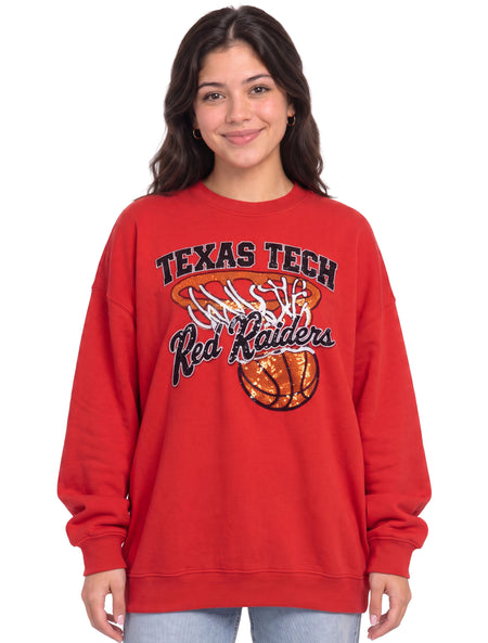 Woman wearing the red Texas Tech rhinestone sweatshirt with the basketball hoop and net design