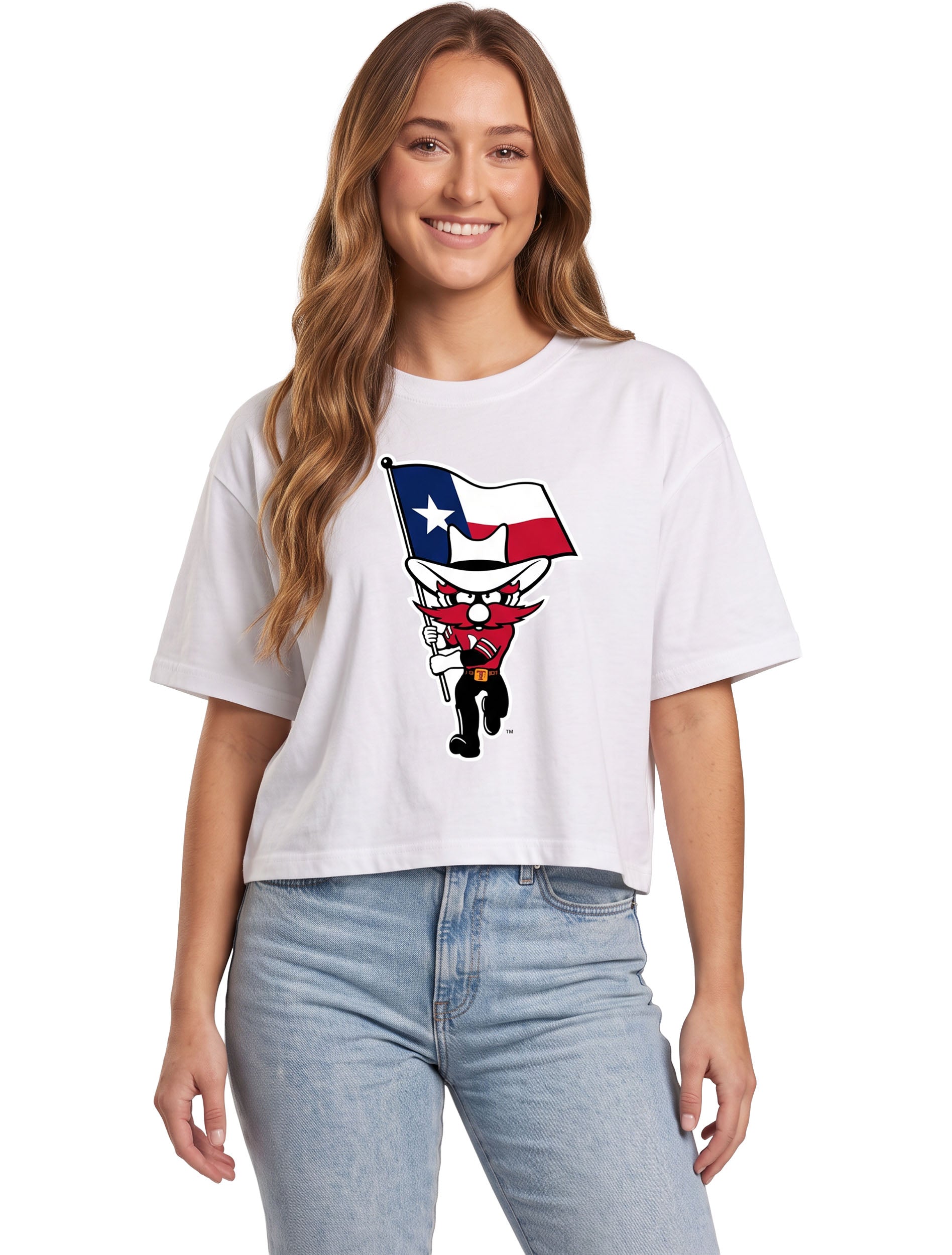 Model wearing a white crop tee with Raider Red running with a waving Texas flag on the chest
