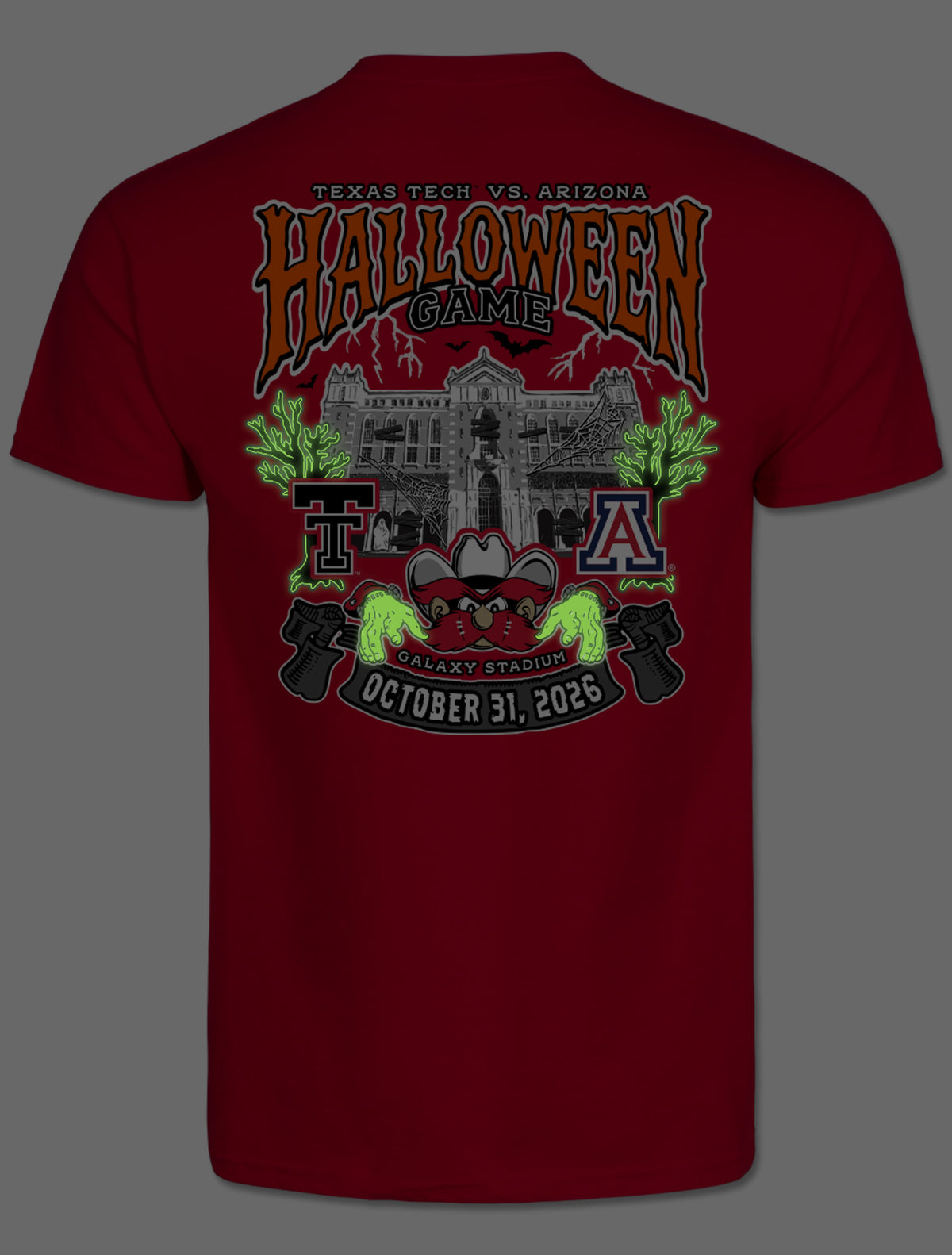 Back of the tee photographed in the dark, showing the Halloween design glowing green