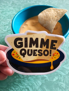 Vinyl sticker reading “Gimme Queso” in playful retro Texas lettering