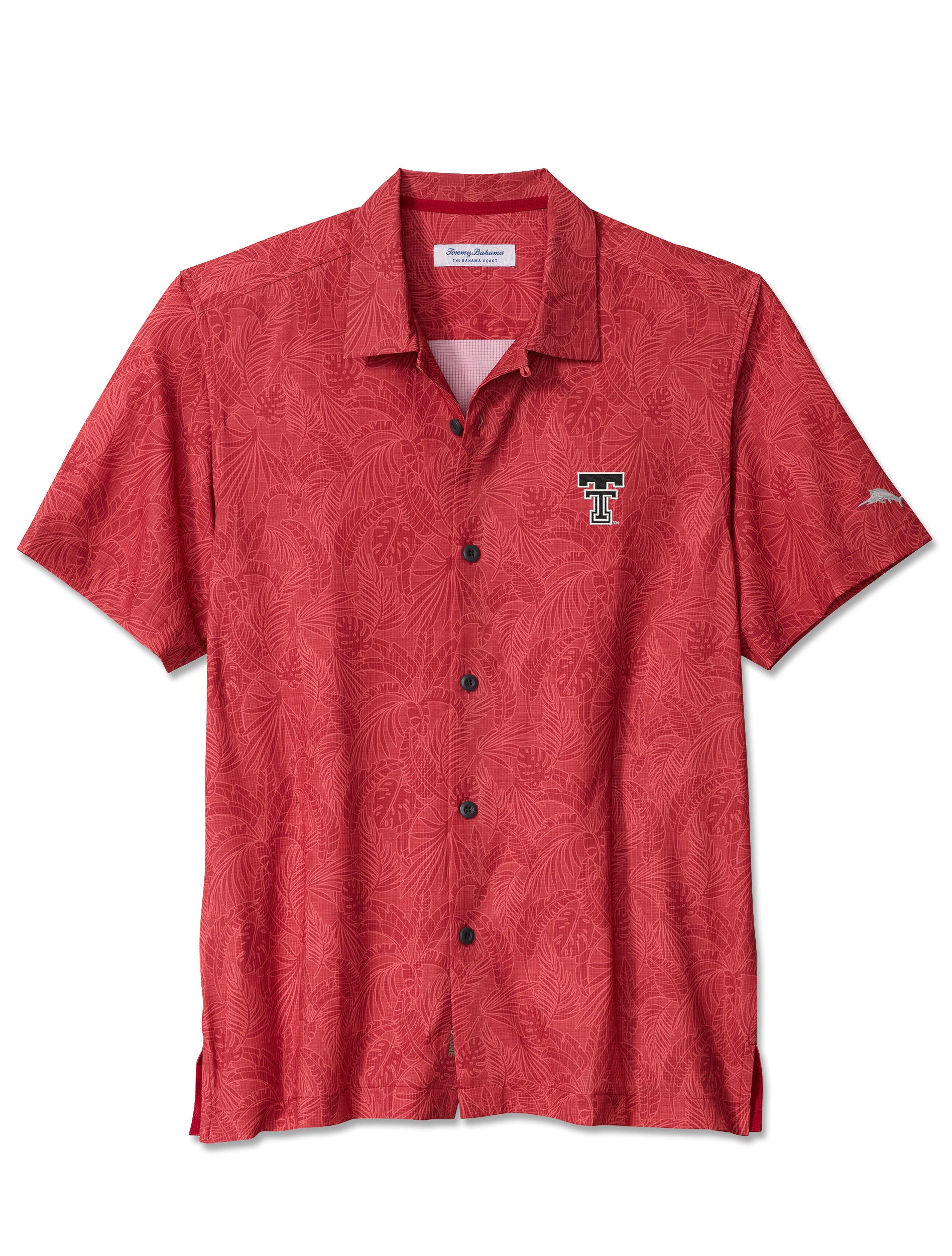 Red Tommy Bahama Texas Tech camp shirt with a tonal monstera and palm frond print, an embroidered Double T at the left chest and the Tommy Bahama marlin at the sleeve