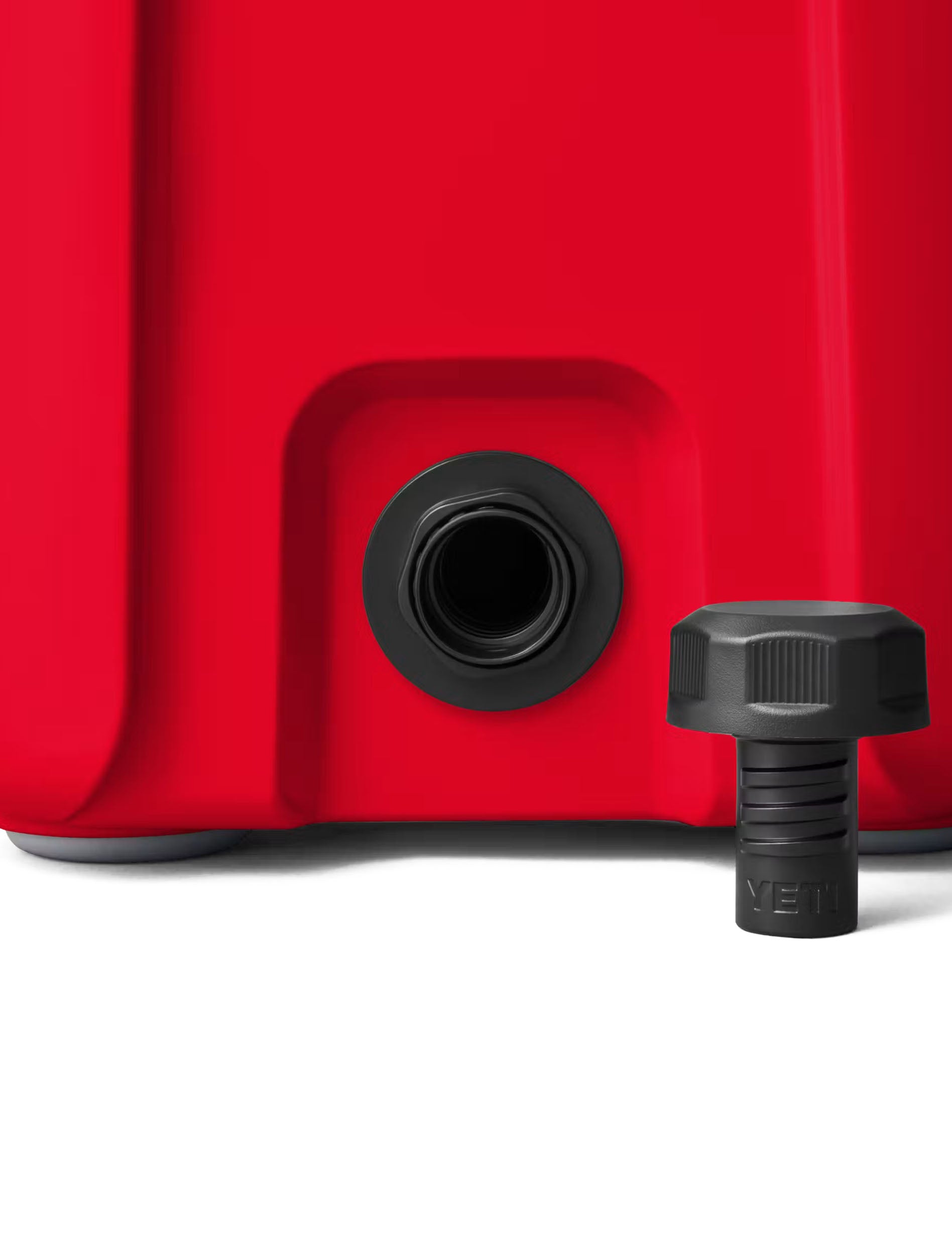 Close-up of the drain plug on the red Yeti Roadie 15 cooler
