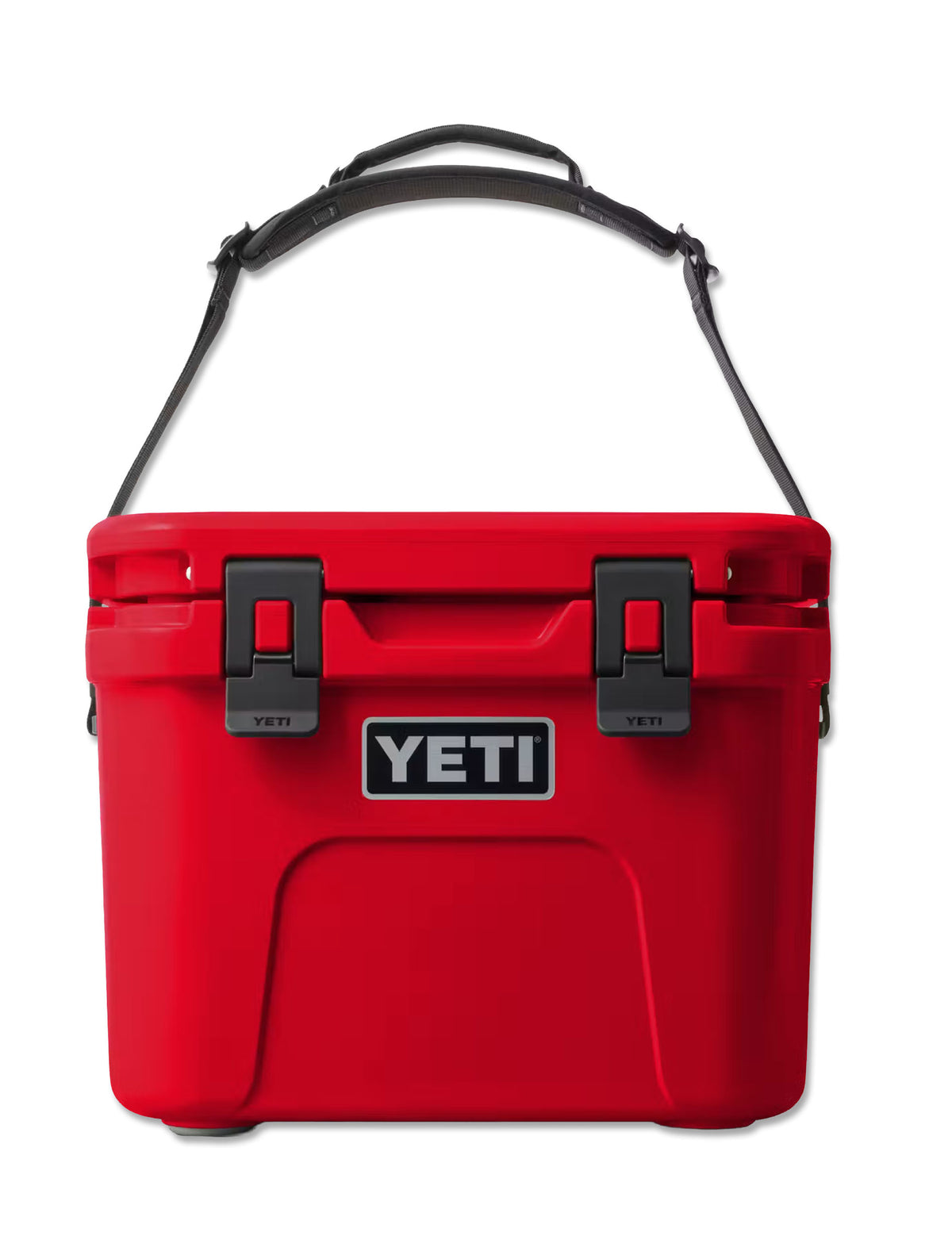 Front of the red Yeti Roadie 15 cooler with the carry strap raised