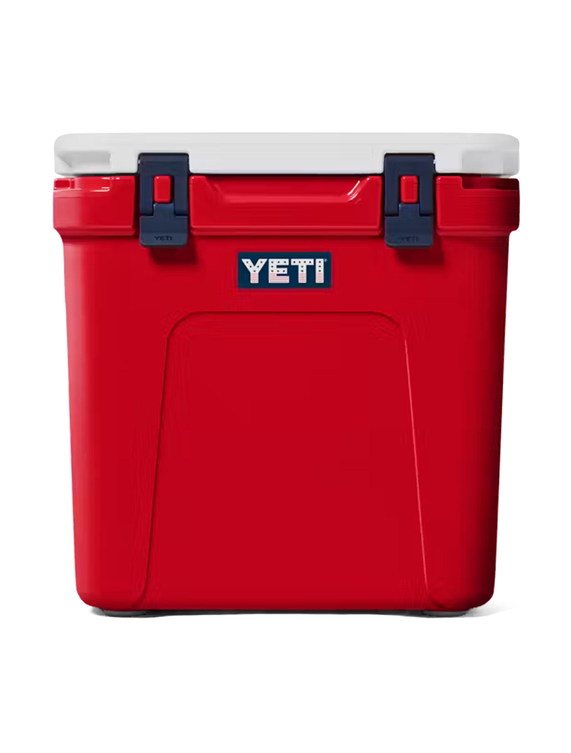 Front of the red Yeti Roadie 48 cooler with navy latches and Yeti badge