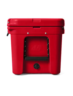 Side of the red Yeti Tundra 45 cooler with its rope handle and drain
