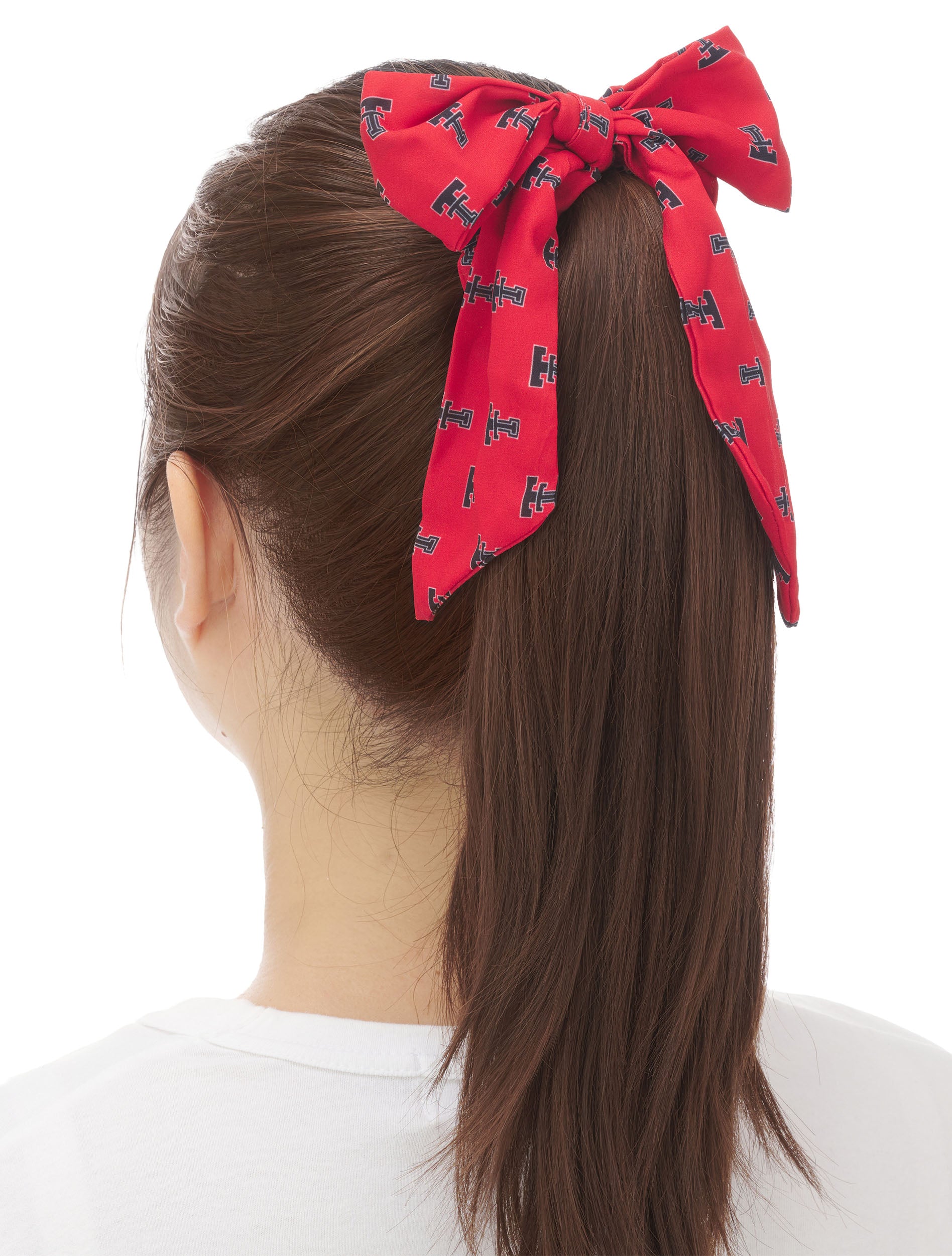 Texas Tech red bow scrunchie with an allover black Double T print, worn on a ponytail