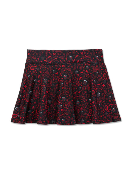 Black ZooZatz Texas Tech youth flow skort with an allover red and white bandana paisley print and small Raider Red faces in the pattern