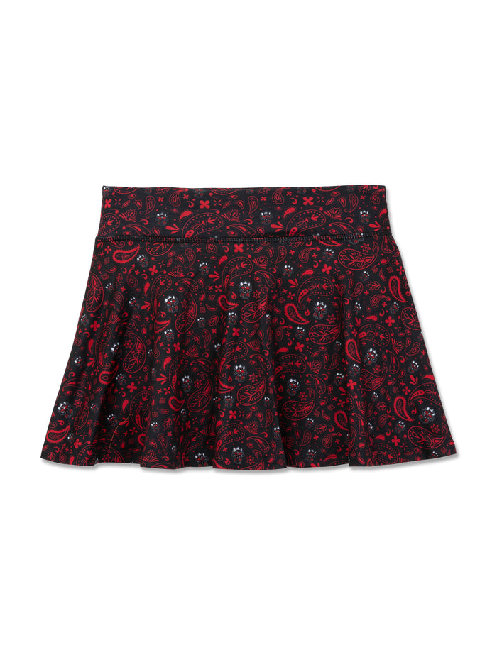 Black ZooZatz Texas Tech youth flow skort with an allover red and white bandana paisley print and small Raider Red faces in the pattern