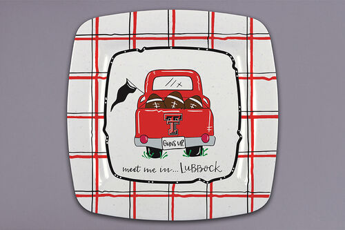 Texas Tech Red Raiders square melamine plate with a red plaid border and a vintage red pickup truck loaded with footballs above meet me in Lubbock script
